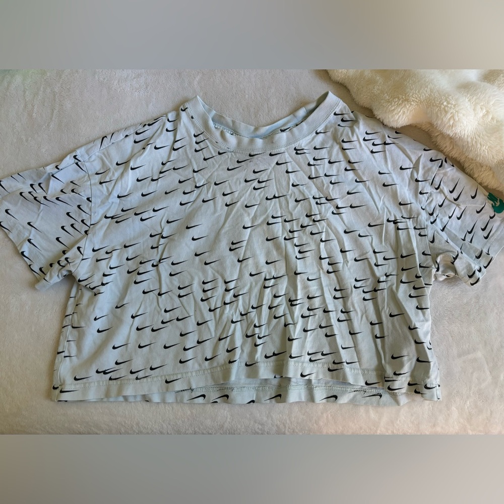 light blue nike logo shirt in size medium